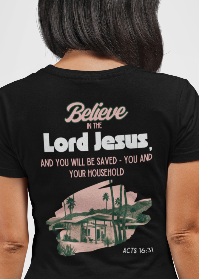 Person wearing a black t-shirt with Scripture Act 16:31 in back