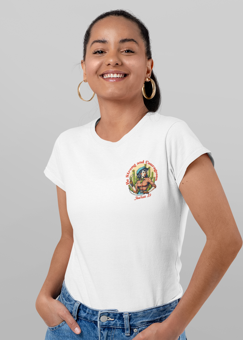 A woman modeling a white short-sleeve graphic T-shirt shown from both front and back against a light gray studio background. The front has a small multicolor chest graphic, and the back has a large graphic with the text 'Be Strong and Courageous' and 'Tula 1915'.