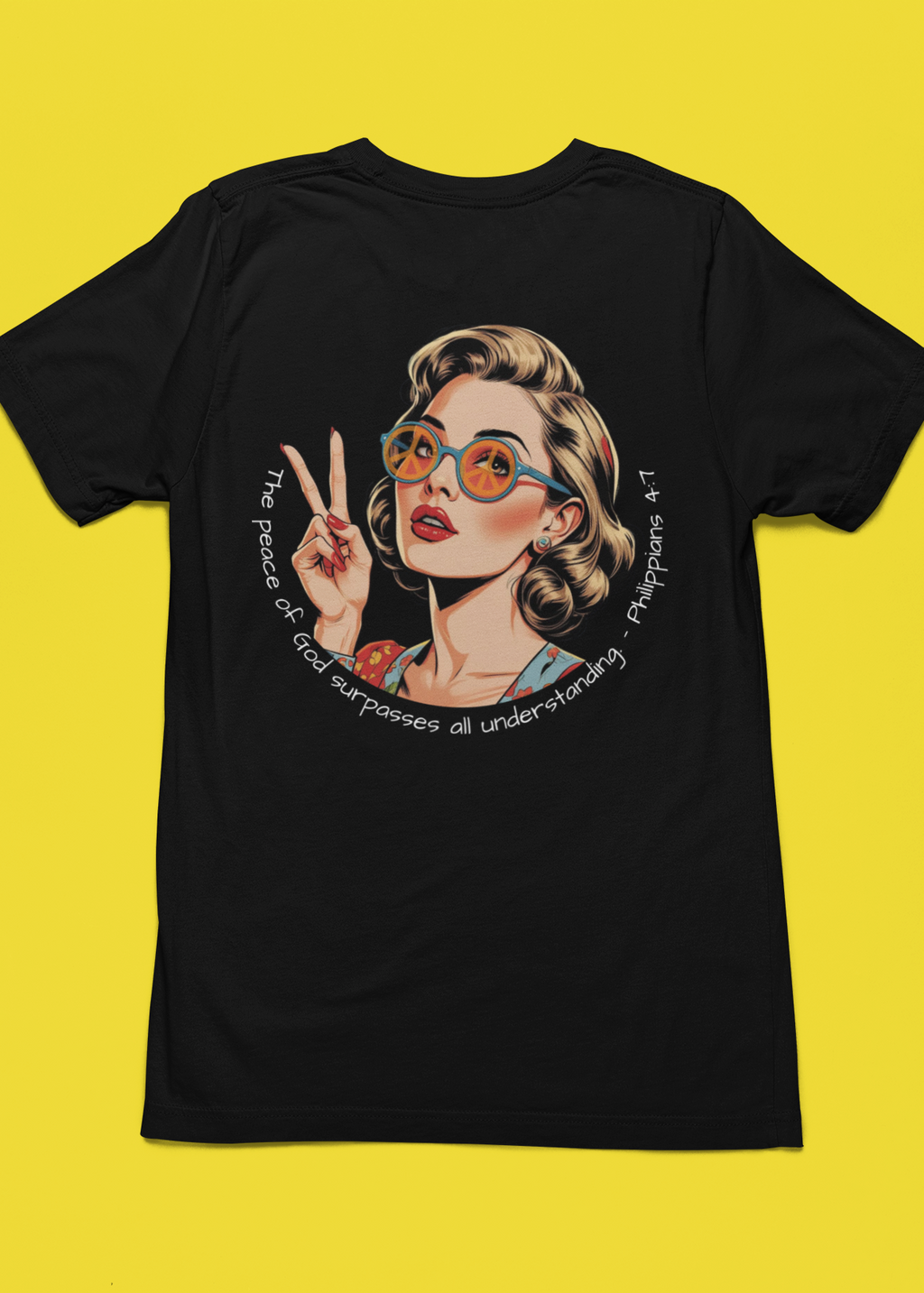 Black t-shirt with a graphic of a woman making a peace sign on a yellow background