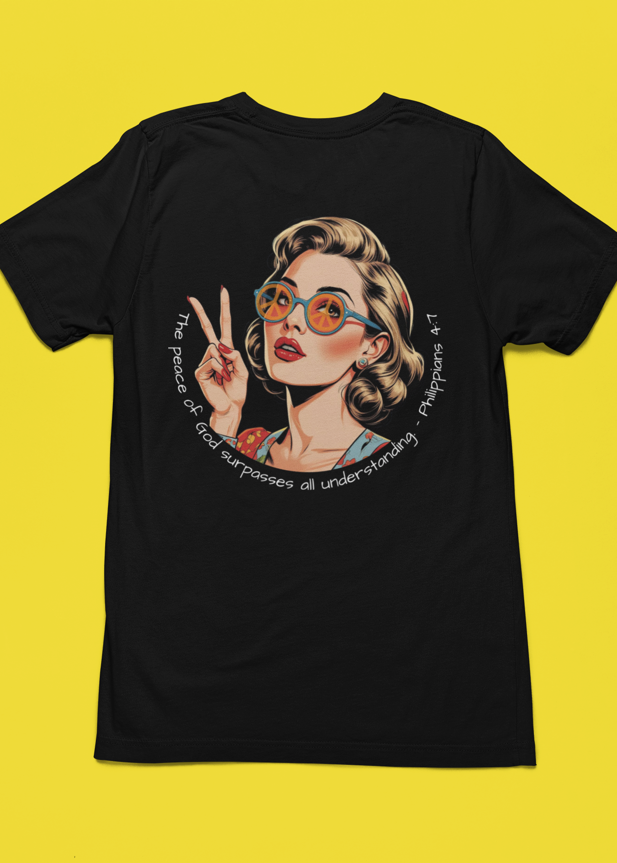 Black t-shirt with a graphic of a woman making a peace sign on a yellow background