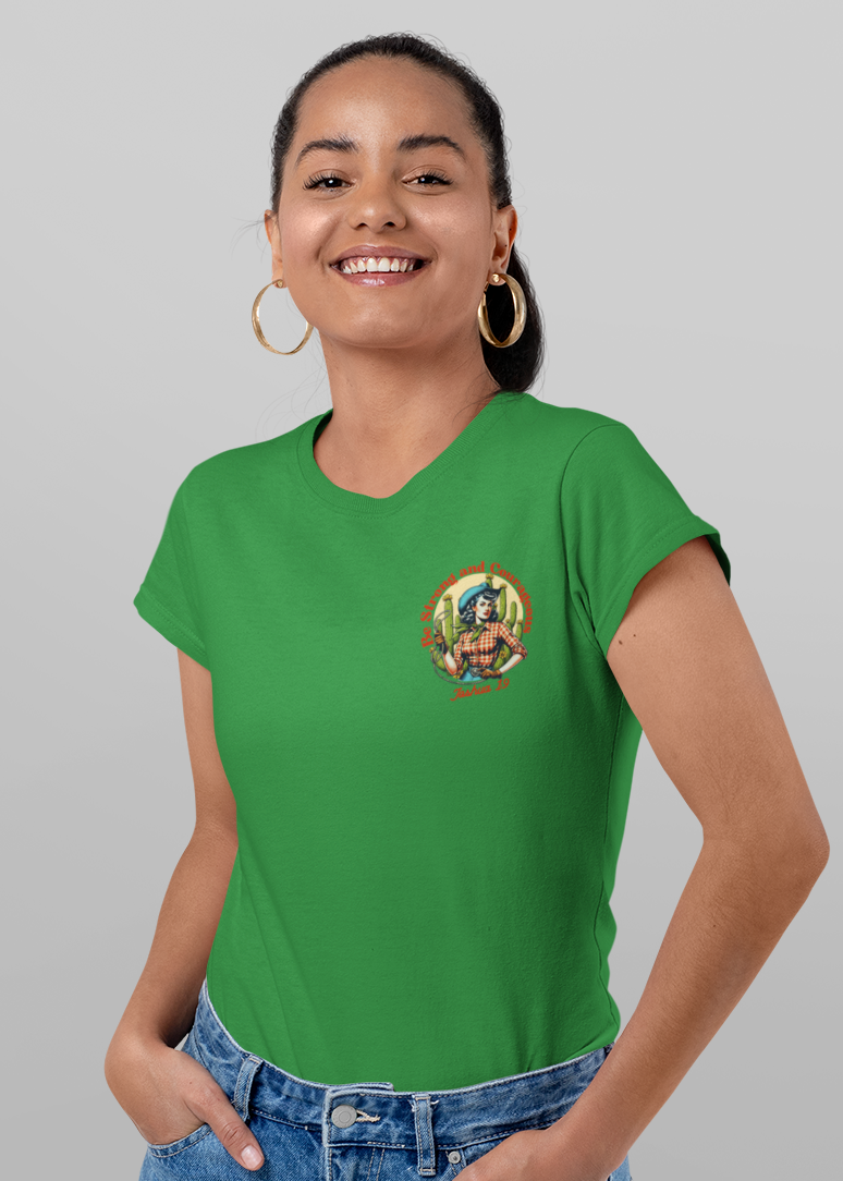 A woman modeling a bright green short-sleeve t-shirt, shown from both the front and back. The front features a small circular graphic on the left chest, while the back displays a large, colorful graphic of a woman in a cowboy hat with cacti and the text 'SALVADOR'.