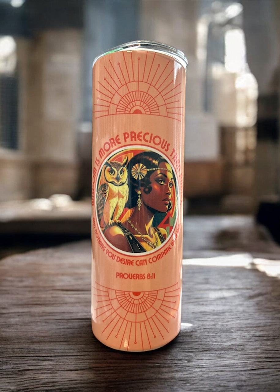 Cylindrical product with a colorful label featuring an owl and face design on a wooden surface.- Roaring Faith