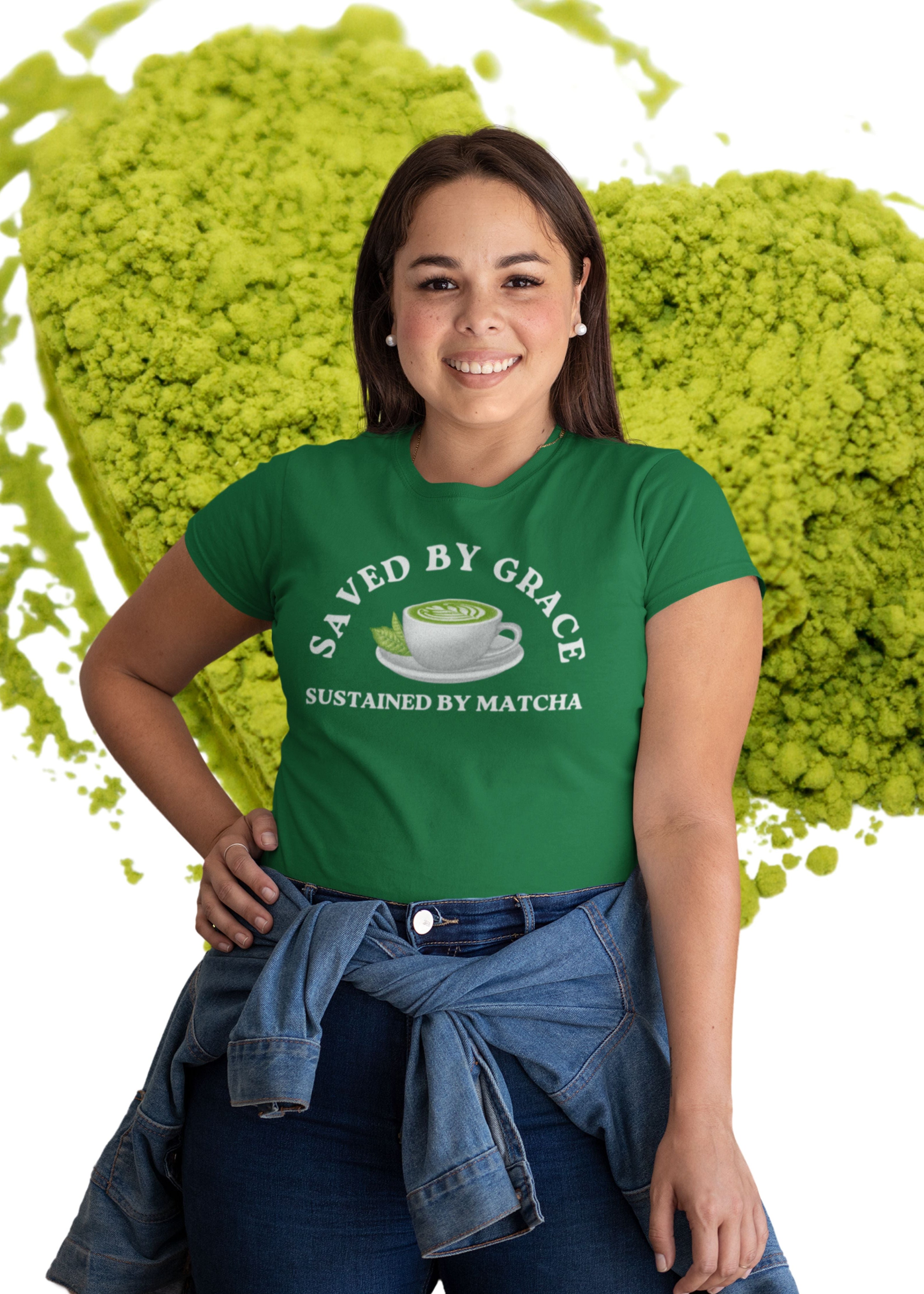Person wearing a green t-shirt with matcha-themed design in front of green powder