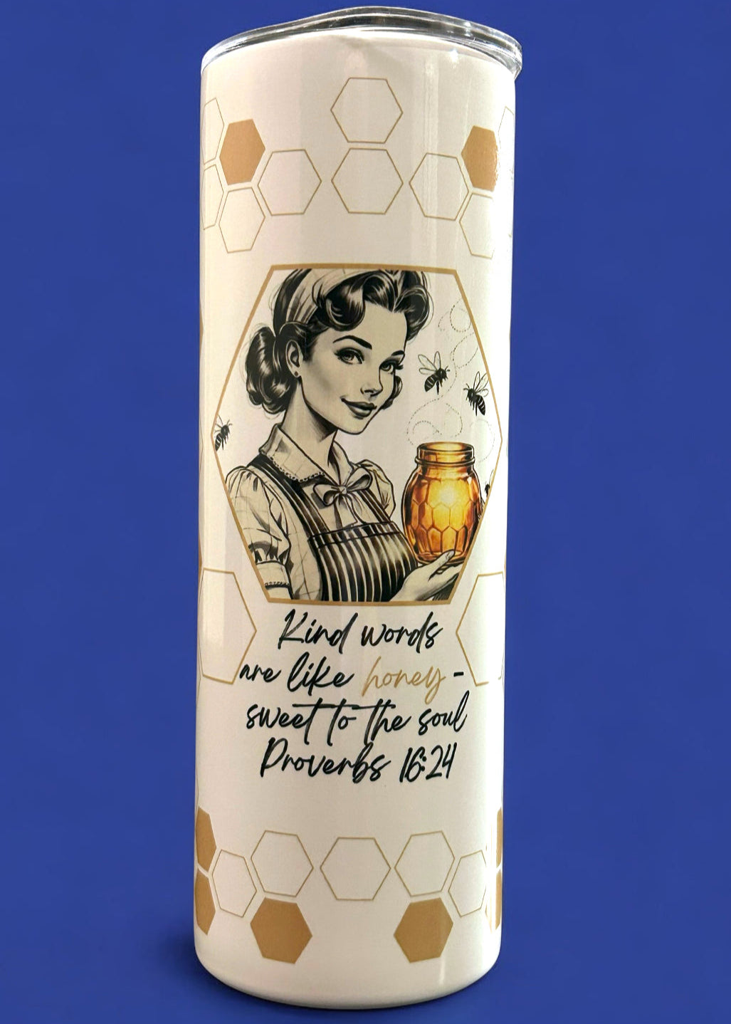 Tumbler with vintage-style design of a woman holding a honeycomb and text on a blue background