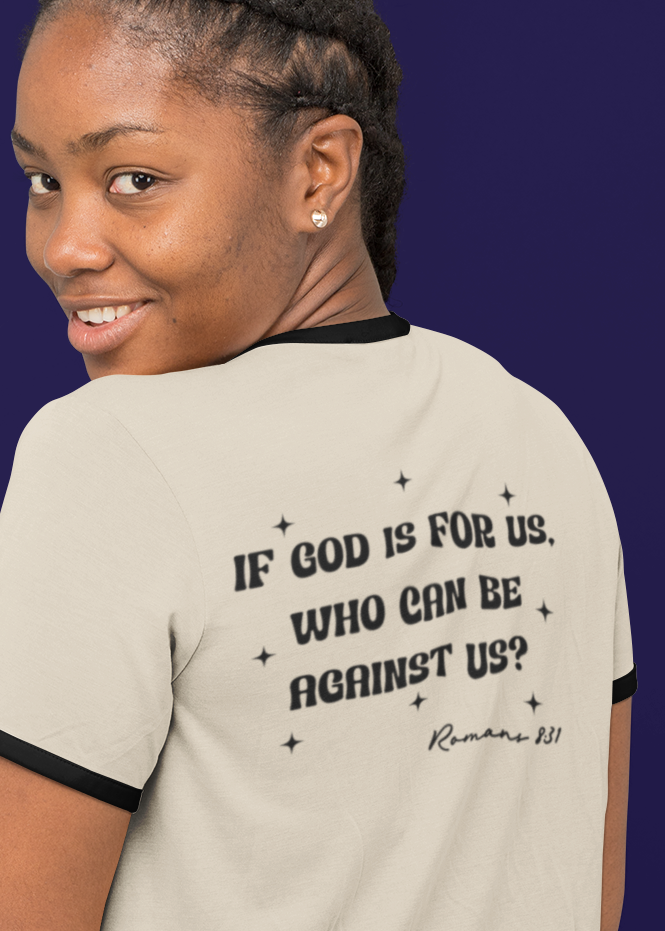 Woman wearing a t-shirt with text on the back against a dark background