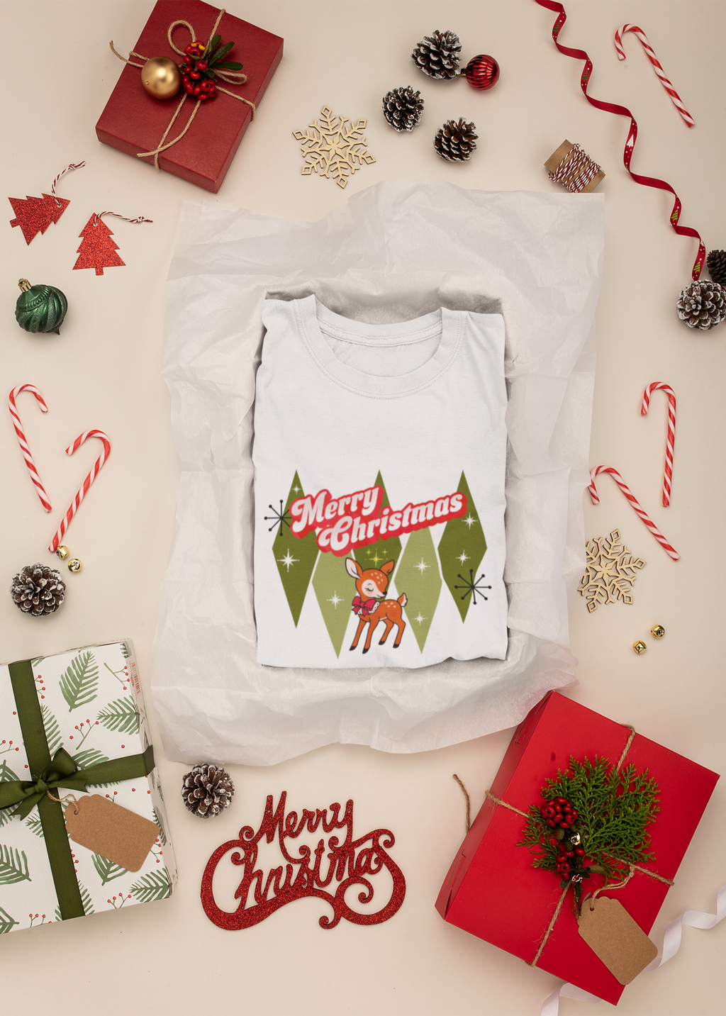 White t-shirt with 'Merry Christmas' design surrounded by festive decorations on a light background